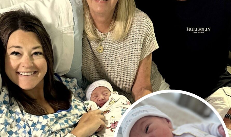 (Alan Jackson in the moment he became a grandfather for the first time) No introduction needed. This photo already tells a story — of life, of time, and of a love that never fades. Years ago, Alan cradled his baby girl in his arms, singing soft ballads straight from the heart.
